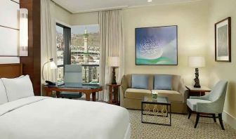 King bedroom with desk and sofa at the Conrad Makkah.