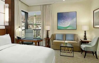 King bedroom with desk and sofa at the Conrad Makkah.