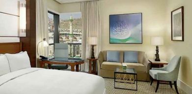 King bedroom with desk and sofa at the Conrad Makkah.