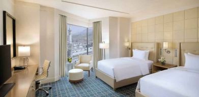 Twin room with desk at the Hilton Makkah Convention Hotel.