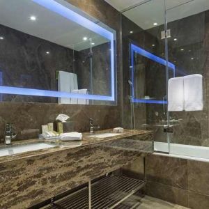 spacious king bathroom with shower and bath at Hilton Garden Inn Istanbul Ataturk Airport.