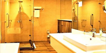 clean and spacious bathroom with shower at DoubleTree by Hilton Nairobi Hurlingham.