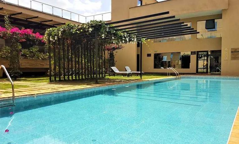 lovely outdoor pool with sun beds at DoubleTree by Hilton Nairobi Hurlingham.