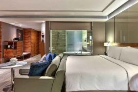 King suite with sofa and working station at the Hilton Sukhumvit Bangkok.