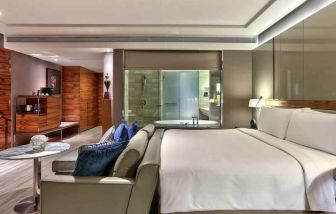 King suite with sofa and working station at the Hilton Sukhumvit Bangkok.