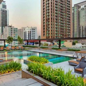 Outdoor pool area suitable as workspace at the DoubleTree by Hilton Sukhumvit Bangkok.