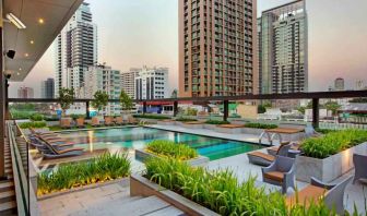 Outdoor pool area suitable as workspace at the DoubleTree by Hilton Sukhumvit Bangkok.