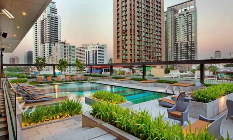 Outdoor pool area suitable as workspace at the DoubleTree by Hilton Sukhumvit Bangkok.