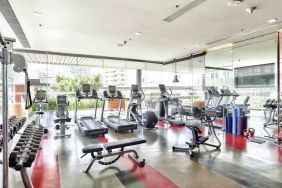 Fully equipped fitness center at the DoubleTree by Hilton Sukhumvit Bangkok.