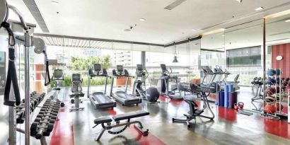 Fully equipped fitness center at the DoubleTree by Hilton Sukhumvit Bangkok.