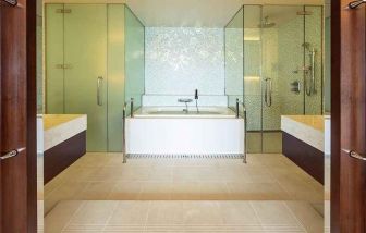 clean and spacious king bathroom with bath and shower at Hilton Fukuoka Sea Hawk.