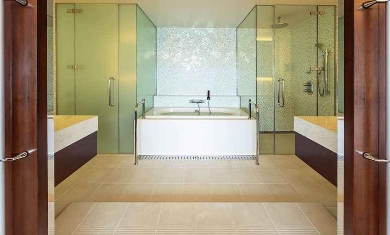 clean and spacious king bathroom with bath and shower at Hilton Fukuoka Sea Hawk.