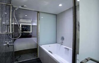 clean and spacious bathroom with bath and shower at Hilton Tokyo.