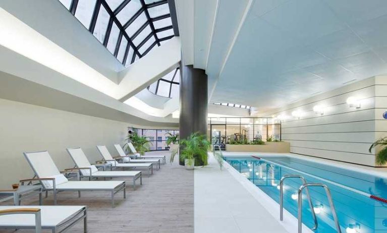 stunning indoor pool with sunbeds at Hilton Tokyo.