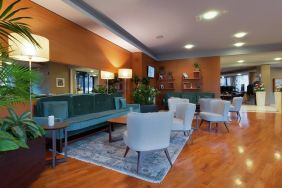 comfortable and spacious lobby and coworking space at Hilton Garden Inn Milan Malpensa.