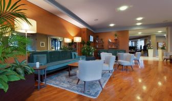 comfortable and spacious lobby and coworking space at Hilton Garden Inn Milan Malpensa.