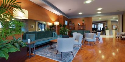 comfortable and spacious lobby and coworking space at Hilton Garden Inn Milan Malpensa.