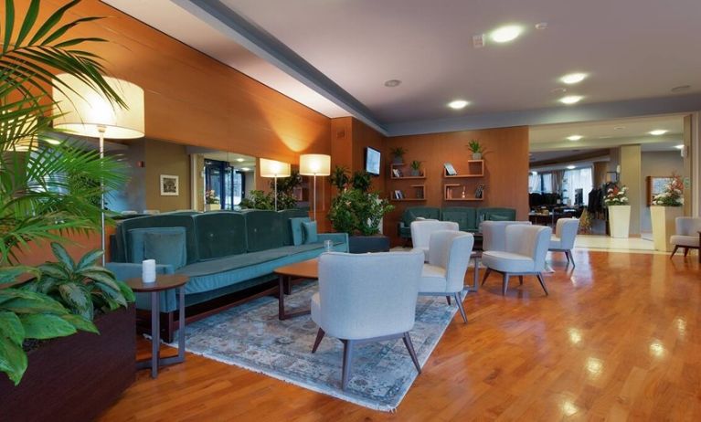 comfortable and spacious lobby and coworking space at Hilton Garden Inn Milan Malpensa.