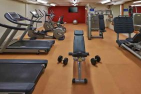 Fitness center with treadmills and machines at the Hilton Zurich Airport.