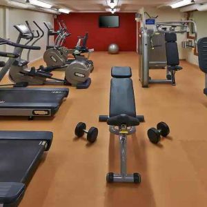 Fitness center with treadmills and machines at the Hilton Zurich Airport.