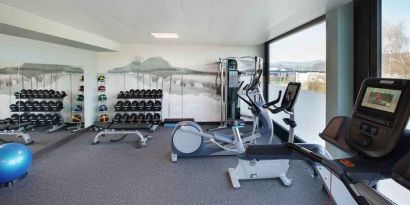 Fitness center with weights and machines at the Hilton Garden Inn Zurich Limmattal.