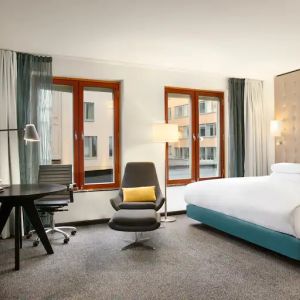 King bedroom with desk at the Hilton Stockholm Slussen.