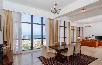 Living room with sofas, tables and chairs at the Hilton Colombo Residence.