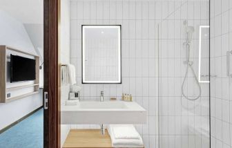 clean and spacious king bathroom with shower at Hilton Garden Inn Riga Old Town.