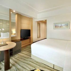 comfortable king room with TV, desk, and chair at DoubleTree by Hilton Riyadh - Al Muroj Business Gate.