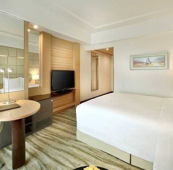 comfortable king room with TV, desk, and chair at DoubleTree by Hilton Riyadh - Al Muroj Business Gate.