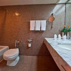 clean and spacious king bathroom with shower and bath combo at Hilton Addis Ababa.