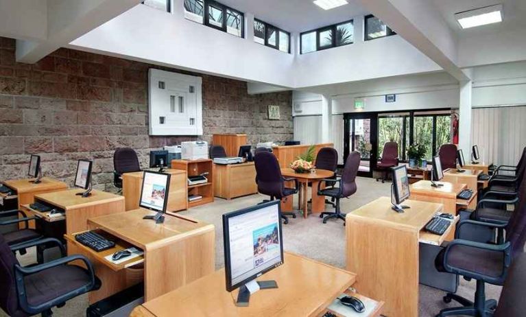 dedicated business center and workspace with PCs, internet, printers, and business desks at Hilton Addis Ababa.