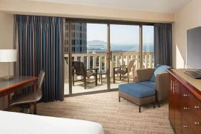 King bedroom with desk and balcony and at the Hyatt Regency San Francisco.