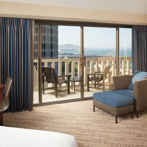 King bedroom with desk and balcony and at the Hyatt Regency San Francisco.