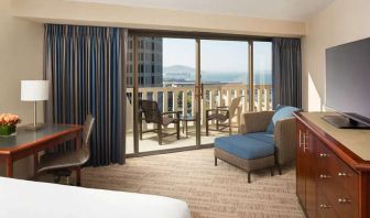 King bedroom with desk and balcony and at the Hyatt Regency San Francisco.