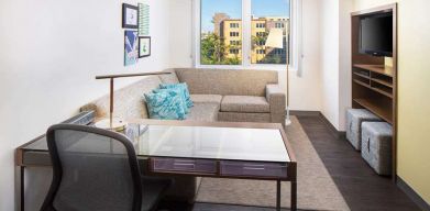 Living room with working station at the Element Miami International Airport.