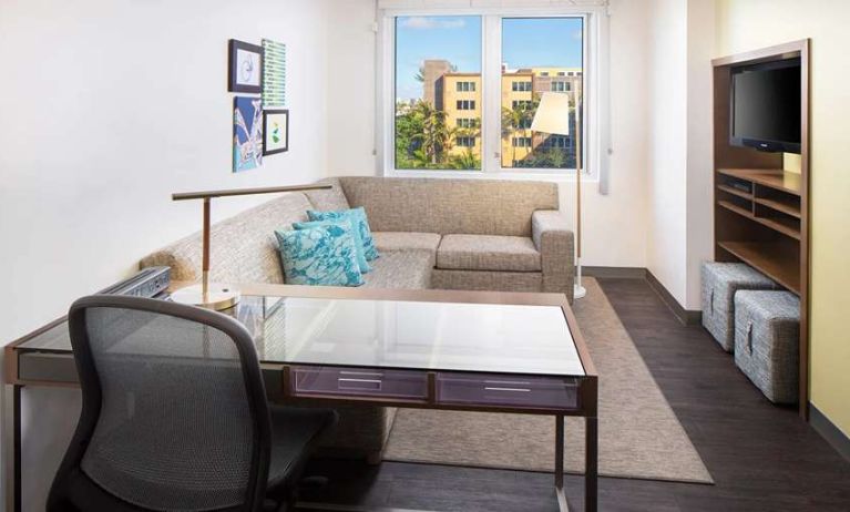 Living room with working station at the Element Miami International Airport.