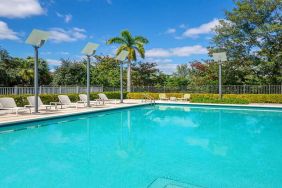 Outdoor pool with lounges at the Element Miami International Airport.