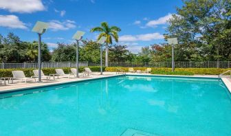 Outdoor pool with lounges at the Element Miami International Airport.