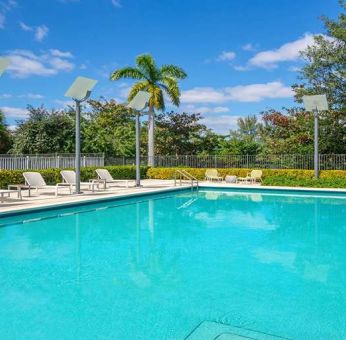 Outdoor pool with lounges at the Element Miami International Airport.