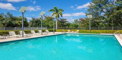 Outdoor pool with lounges at the Element Miami International Airport.