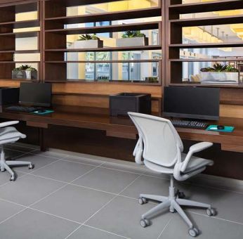 Business center with computers and printer at the Element Miami International Airport.