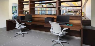 Business center with computers and printer at the Element Miami International Airport.