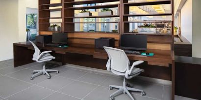 Business center with computers and printer at the Element Miami International Airport.