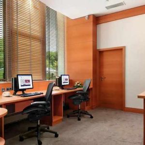 dedicated business center with PC, internet, desk, chair, and printer ideal for working remotely at DoubleTree by Hilton Luxembourg.