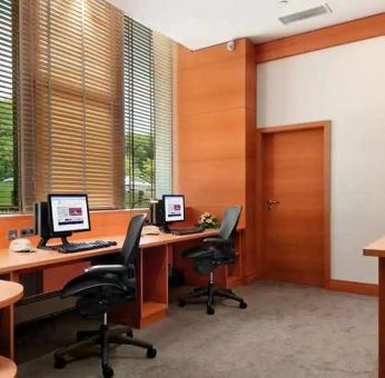 dedicated business center with PC, internet, desk, chair, and printer ideal for working remotely at DoubleTree by Hilton Luxembourg.