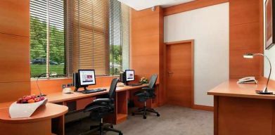 dedicated business center with PC, internet, desk, chair, and printer ideal for working remotely at DoubleTree by Hilton Luxembourg.