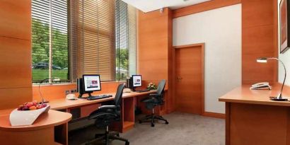 dedicated business center with PC, internet, desk, chair, and printer ideal for working remotely at DoubleTree by Hilton Luxembourg.