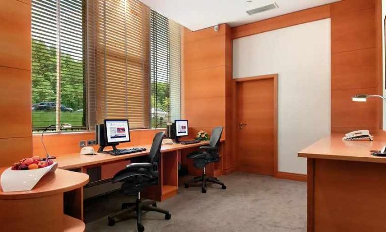 dedicated business center with PC, internet, desk, chair, and printer ideal for working remotely at DoubleTree by Hilton Luxembourg.