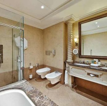 clean and spacious king bathroom with shower and bath at Hilton Beirut Habtoor Grand.